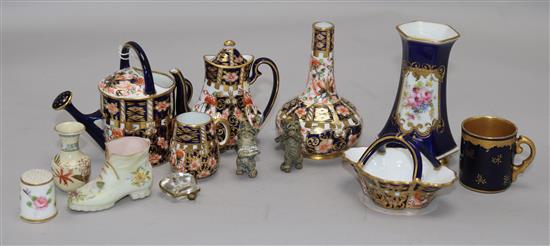A collection of Crown Derby miniature ceramics, pottery cats etc